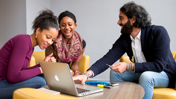 Students conversing with an advisor