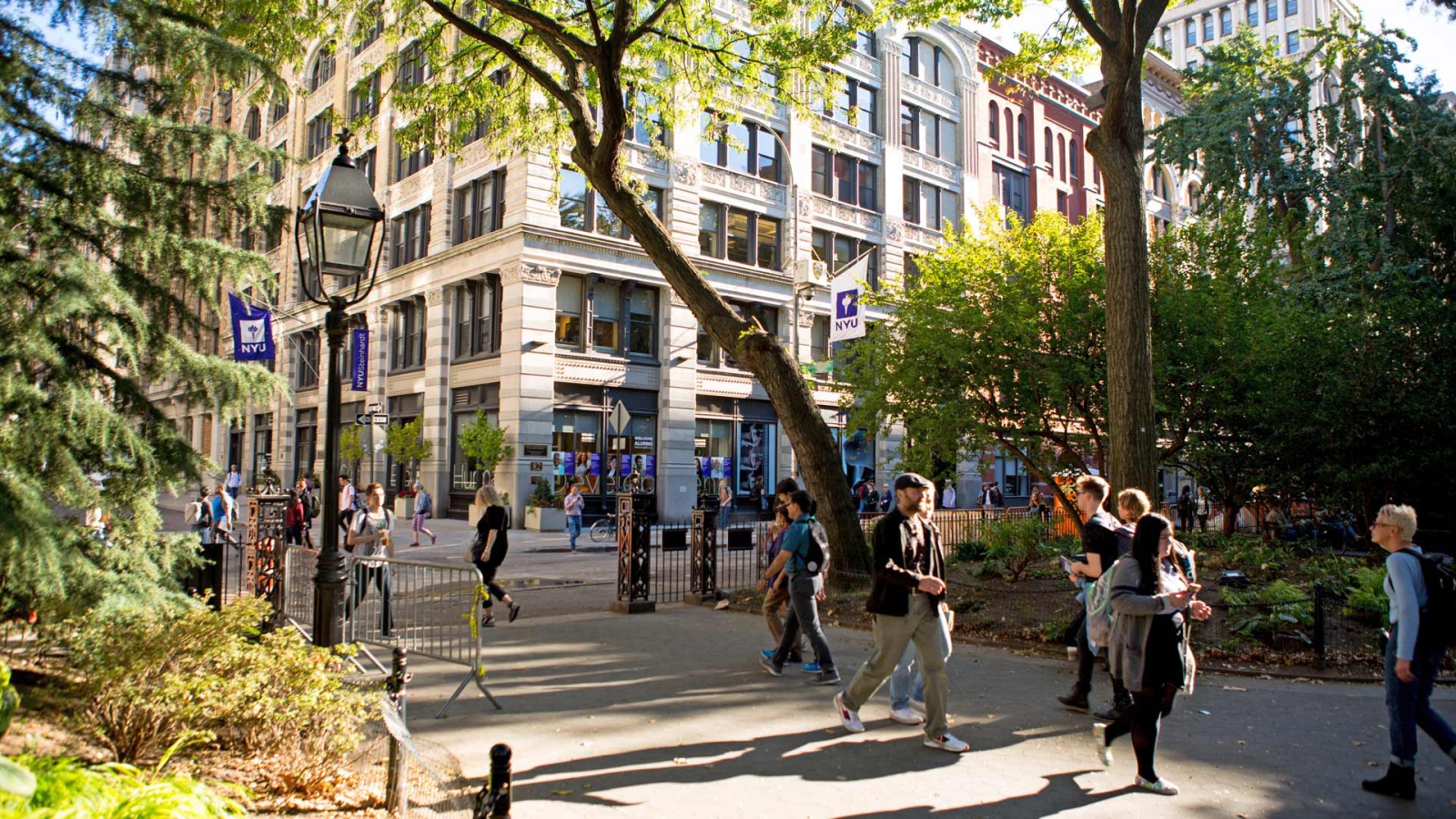 NYU Students walking through Washington Square Park