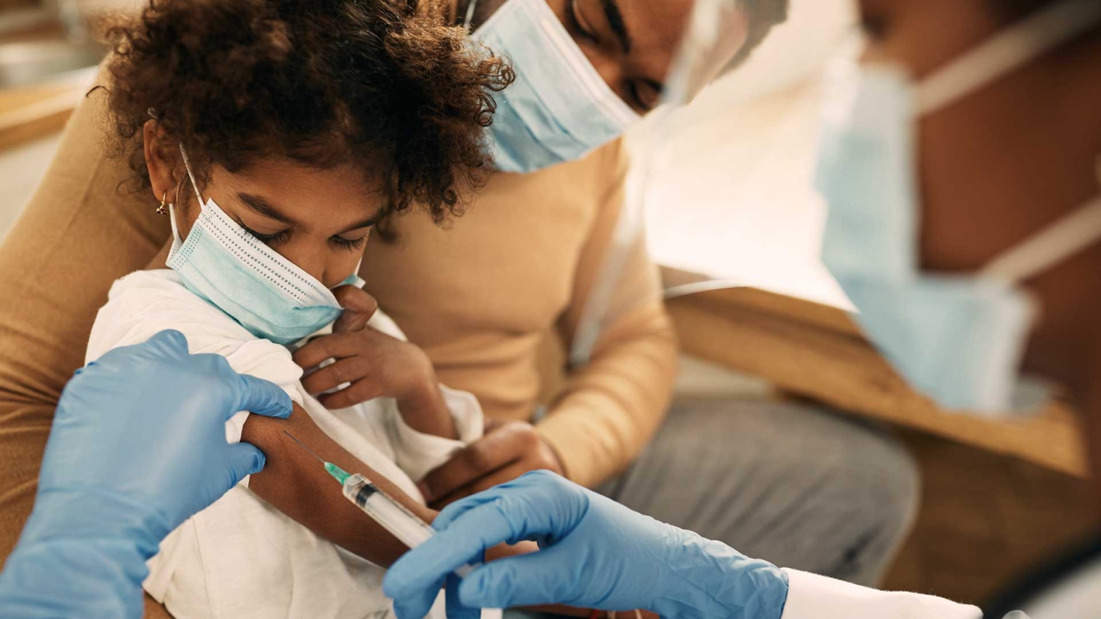 Child getting vaccine injection